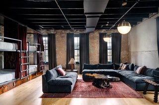 A New Experiential Hostel in Austin Offers Unique Lodging in a Restored Railway Hotel - Photo 7 of 16 - The "Romper Room" is outfitted with eight single beds tucked into handcrafted bunks. 