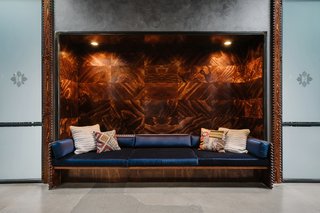 A New Experiential Hostel in Austin Offers Unique Lodging in a Restored Railway Hotel - Photo 10 of 16 - A cozy built-in lounge spot in the "Common Area."