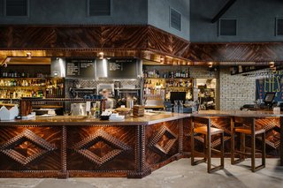 A New Experiential Hostel in Austin Offers Unique Lodging in a Restored Railway Hotel - Photo 12 of 16 - Both guests and locals can enjoy the bar and kitchen, which serves breakfast, lunch, and dinner. 
