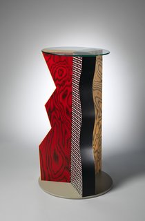 An Exhibit on Italian Designer Ettore Sottsass Highlights His Colorful Work and Rebellious Ways - Photo 6 of 15 - "Ivory" Table, 1985. Formica, Wood, Glass. H. 39-3/4 x Dia. 24 in. b: Glass top; Dia. 19-1/2 x Thickness 1/4 in. The Metropolitan Museum of Art, Gift of Dr. Michael Sze, 2002.
