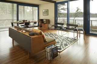 Experience Cape Cod Modern by Staying at the Midcentury Weidlinger House - Photo 5 of 8 - The home is perched above the pond and features panoramic views of the natural surroundings. 