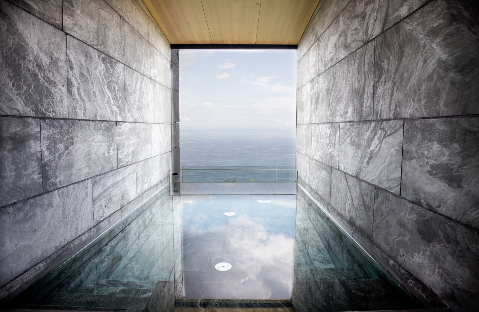 40 Modern Bathtubs That Soak In the View The wellness area is divided into two areas: a wet zone with a stone swimming pool, sauna, and a Turkish bath; and a separate zone for spa treatments.