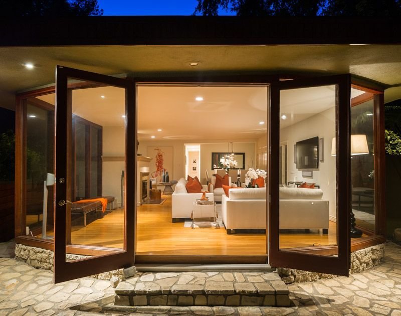 The living rooms opens to the backyard.