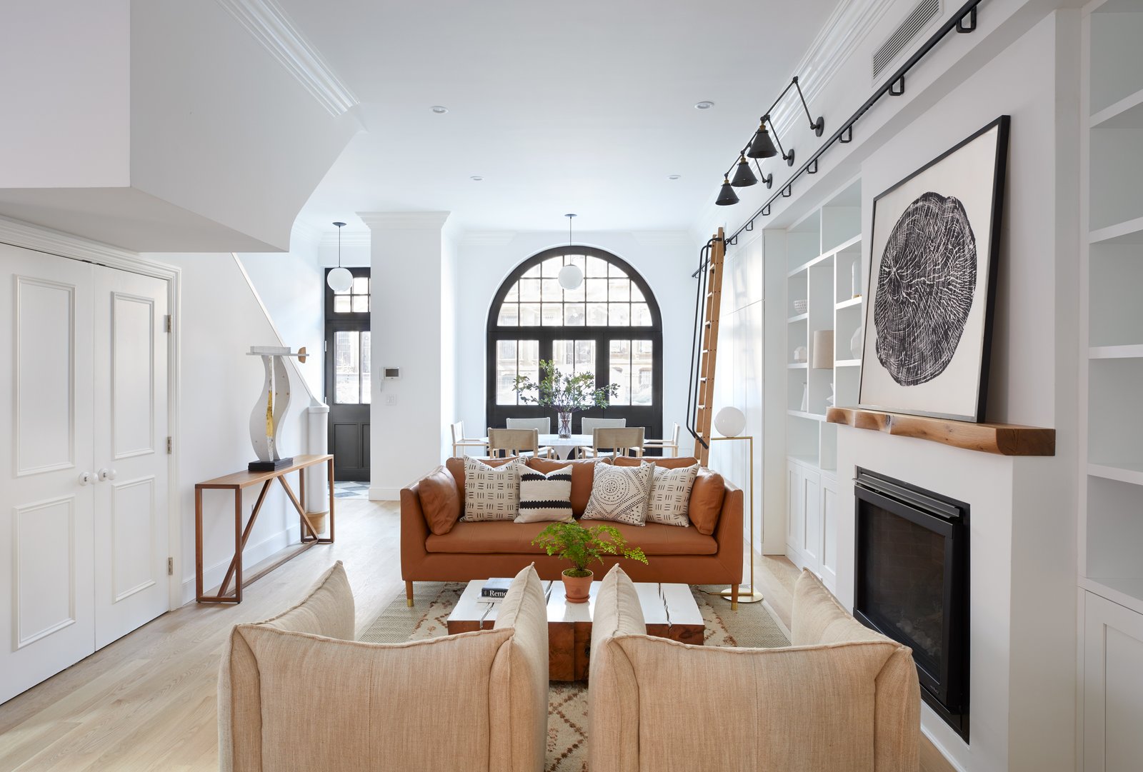 Built-in shelving and a gas fireplace with a customized mantel by Fitzhugh Karol preside over 411 Vanderbilt's living room.