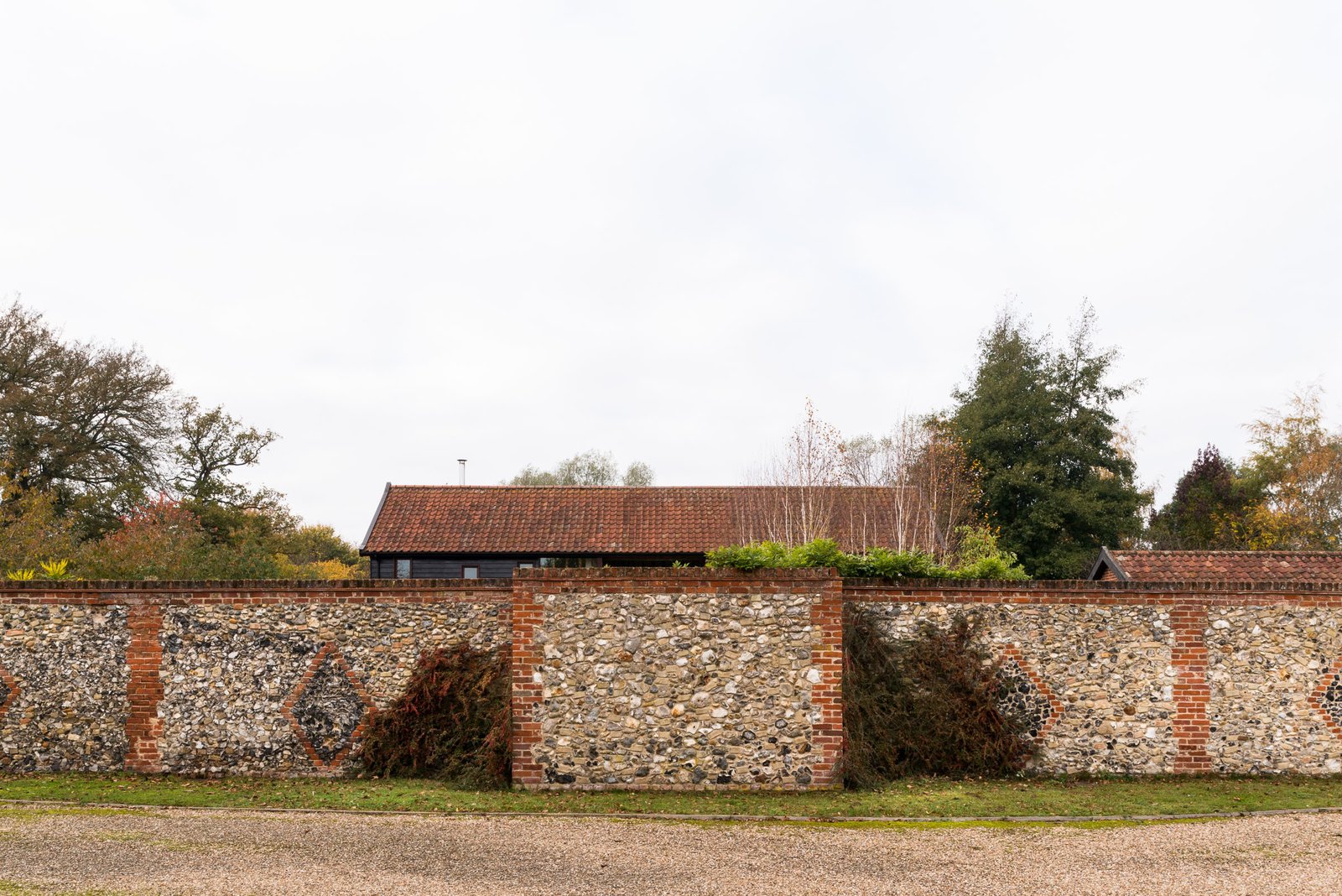 An exterior stone wall surrounds the property.