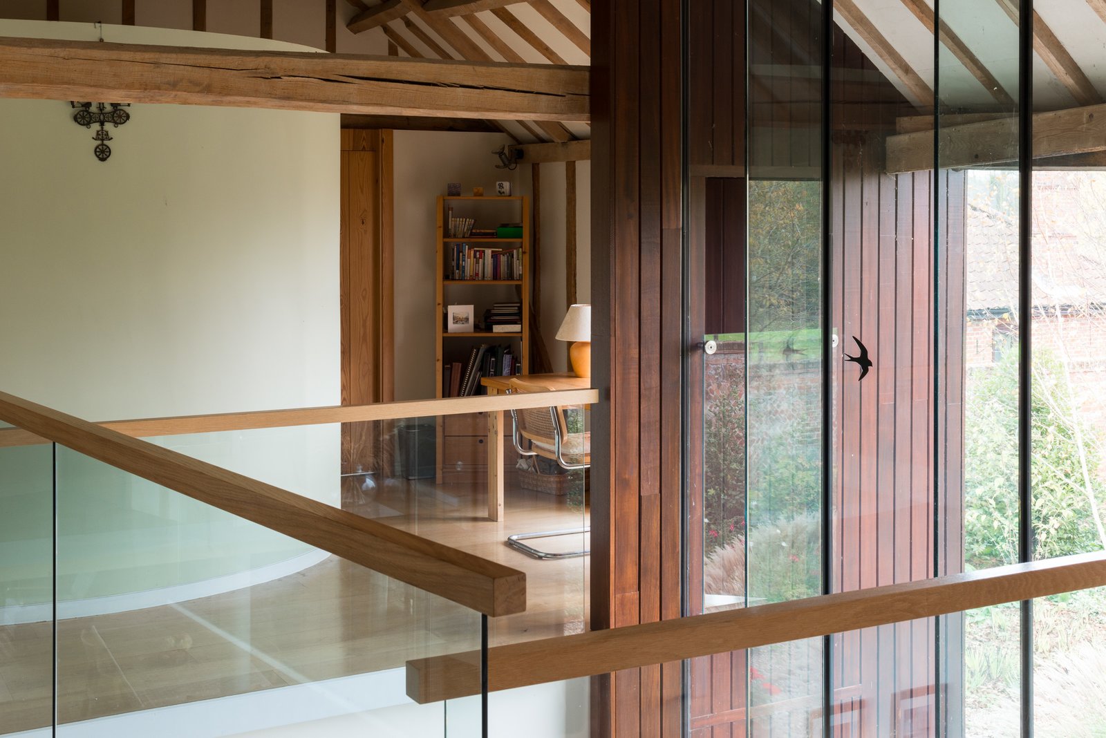 The striking juxtaposition of wood and glass.