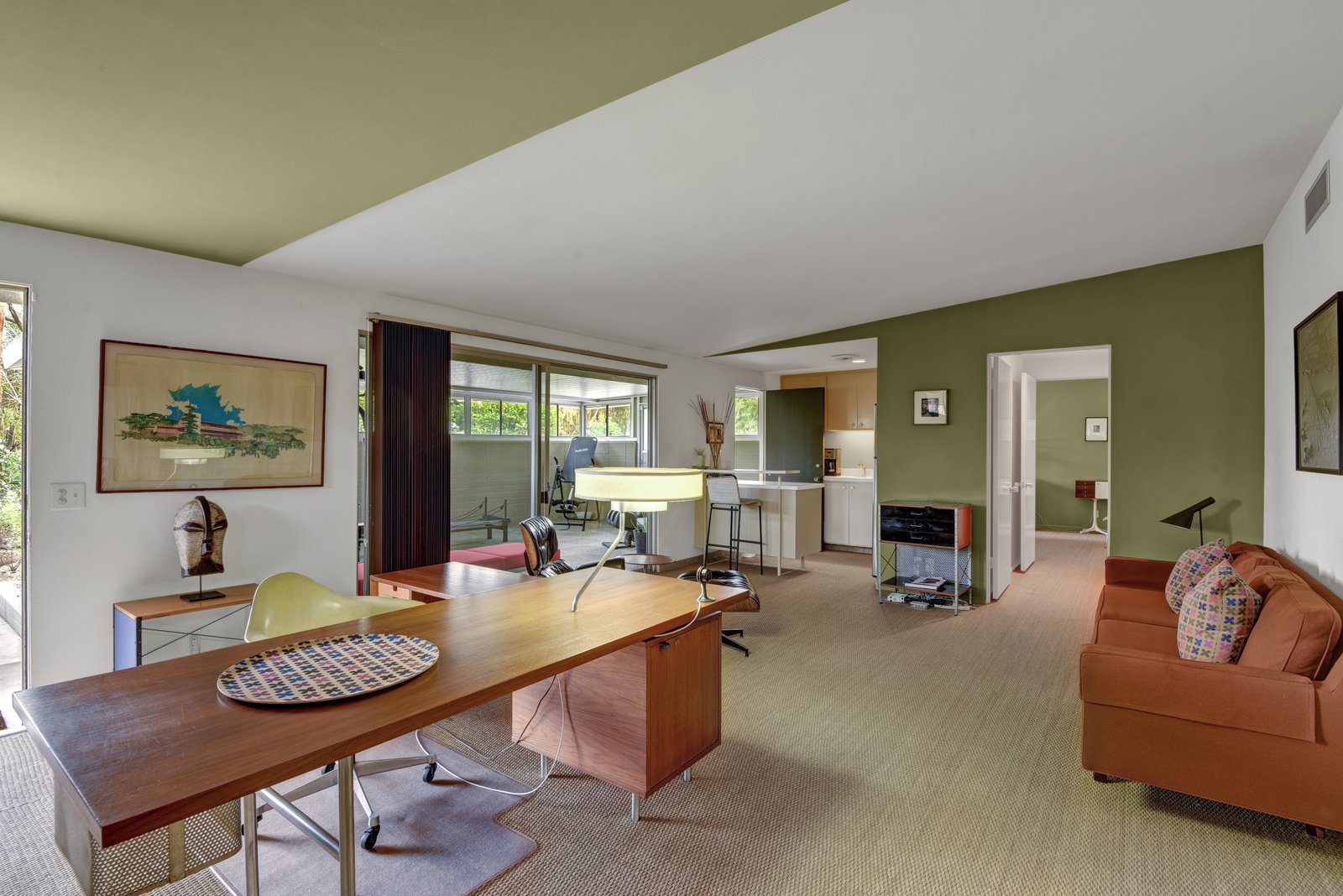Currently, used as a study and guest suite, a portion of the home could be used as a separate residence or in-law suite with a fully equipped kitchen and enclosed private patio, yard, and orchard access.