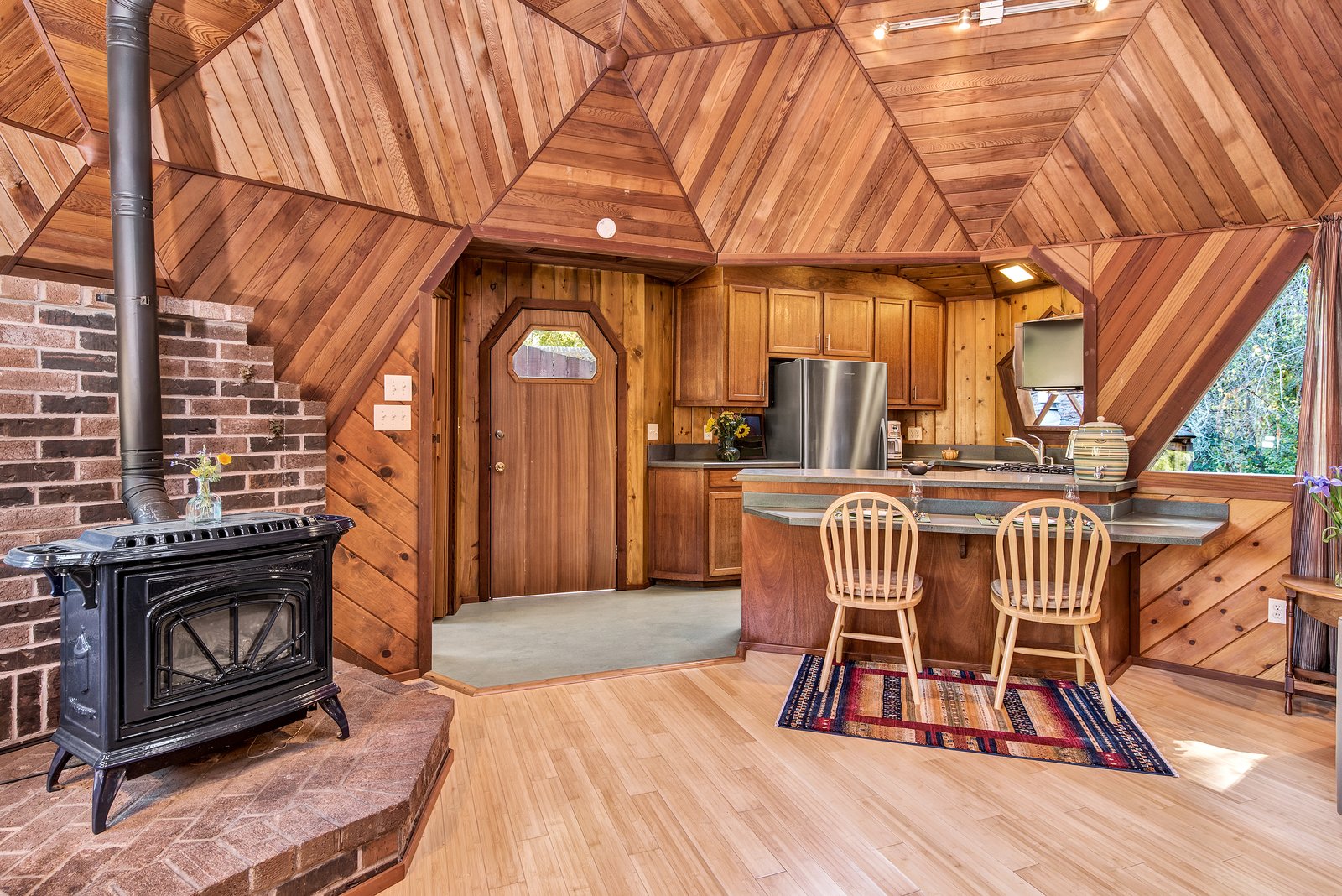 The wood-burning stove keeps the home warm on cool nights.