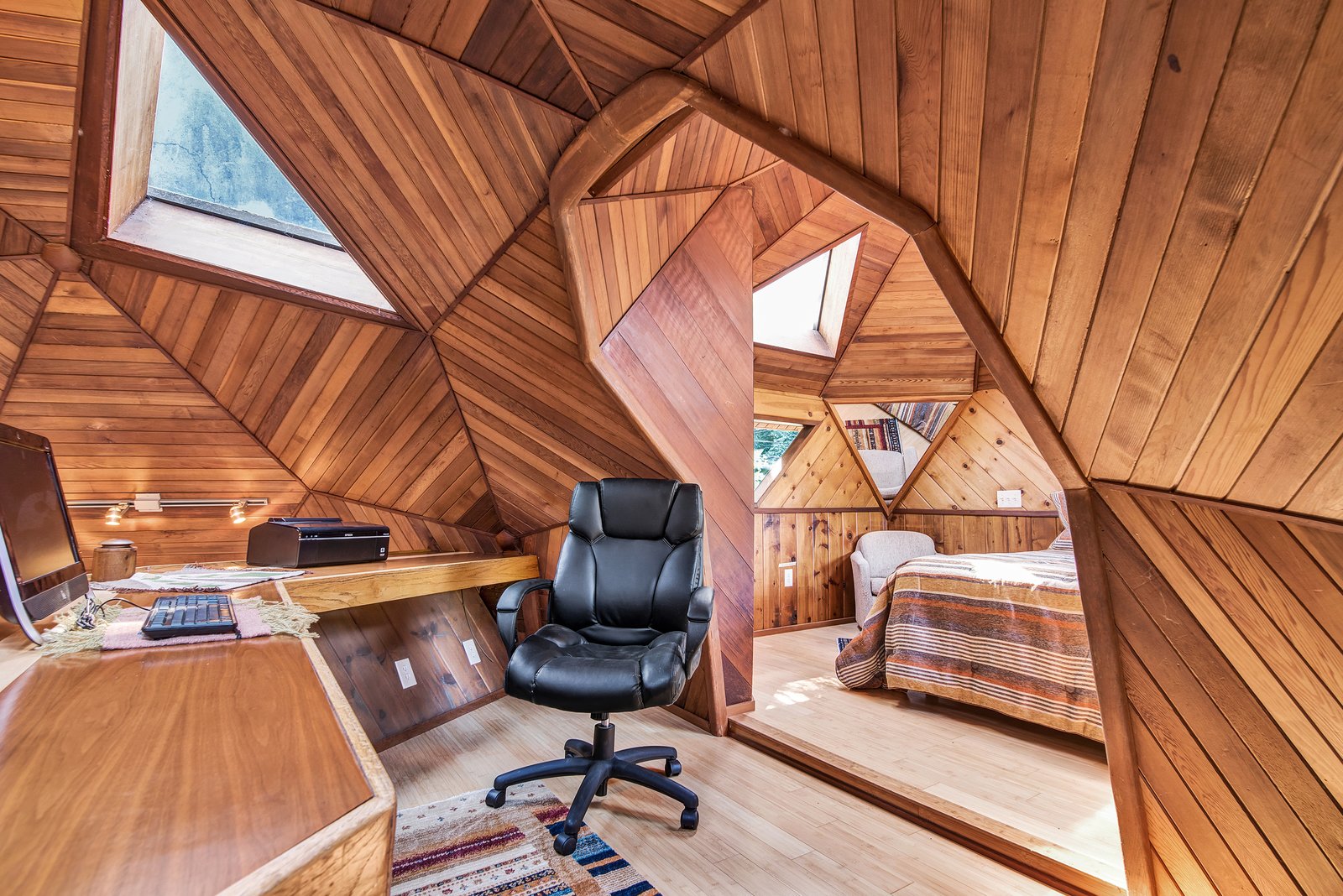 An office space is off the bedroom.