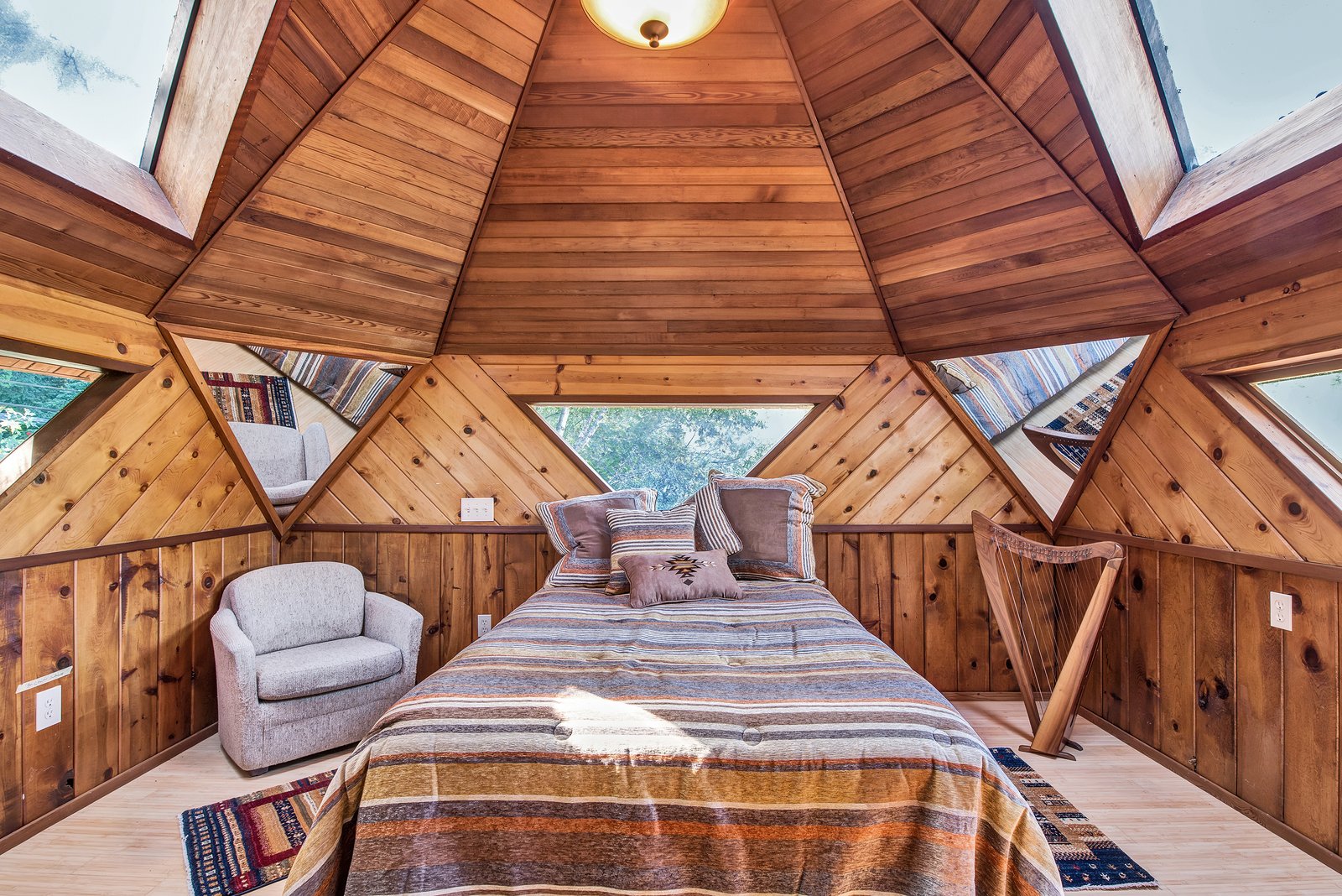 Watch the stars through triangular windows in the domed bedroom.