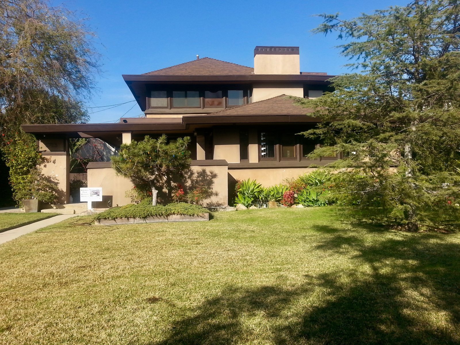 The home features an impressive backyard with mature fruit and shade trees.