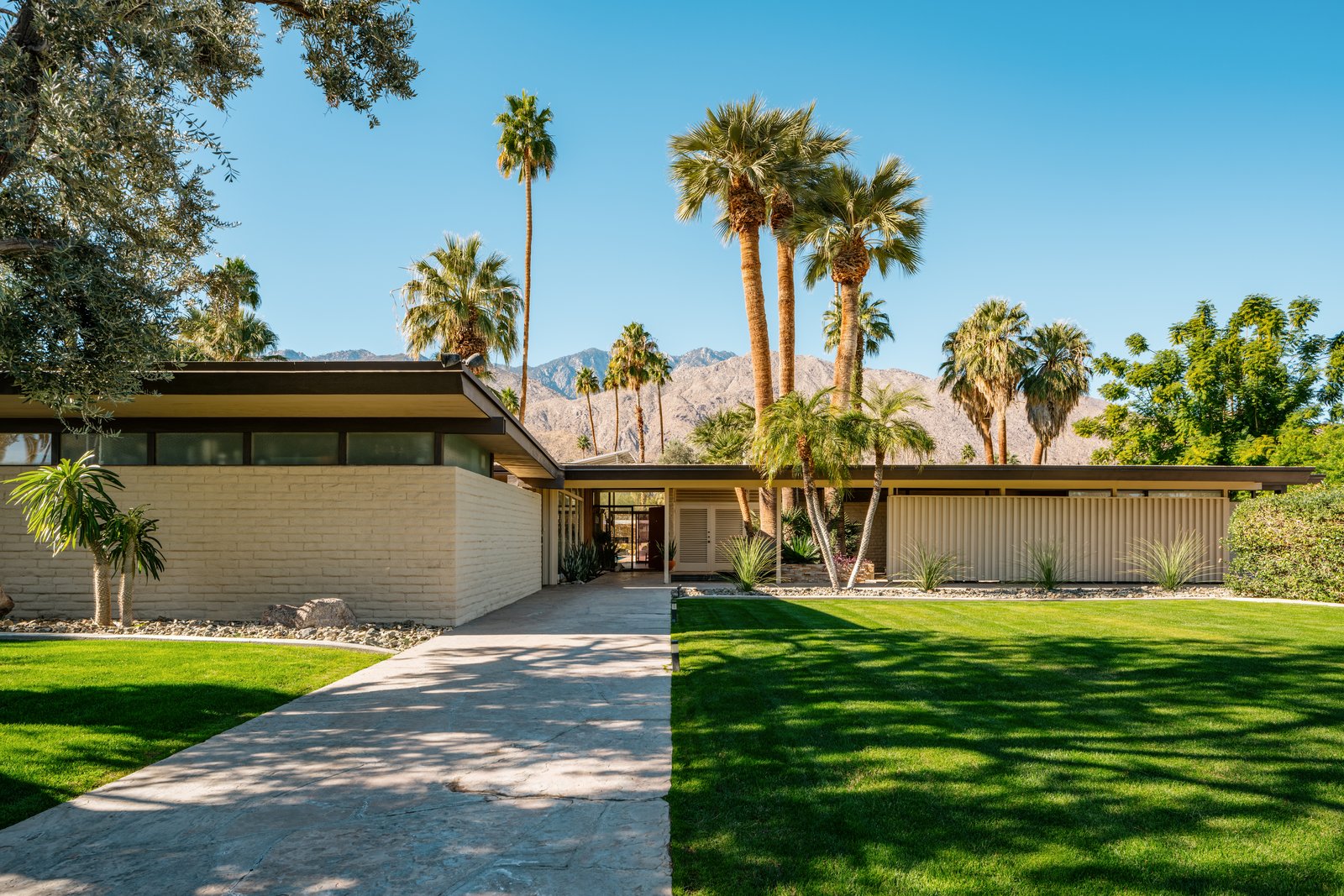 Setback from the street, this extremely private one level property has sliders with outdoor access, solar panels, and mountain views from every room.