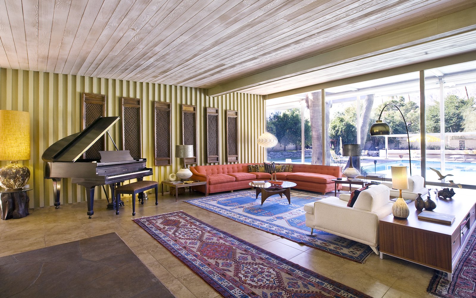 Interiors feature Williams’ iconic architectural details, including natural teak wood paneling; built-in cabinetry, credenzas, and vanities; wood ceilings; slump stone walls and fireplace; clerestory windows; board-and-batten redwood siding; and original fixtures.