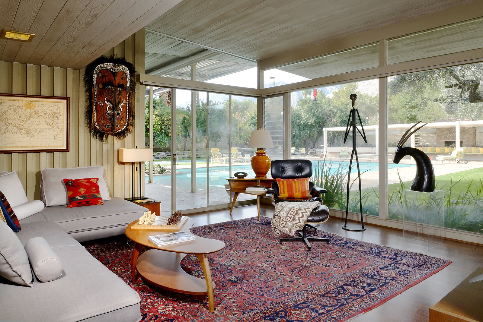 The estate also includes a maids quarters (or office with bath), a sunroom, and an interior pond and atrium.