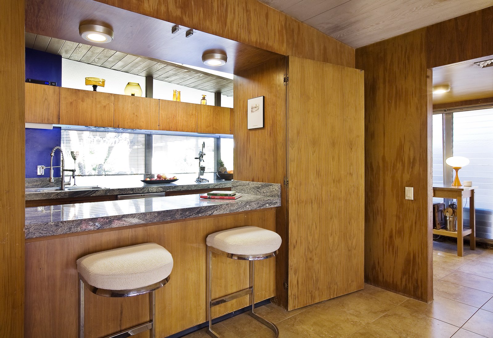 Bar seating by the kitchen.