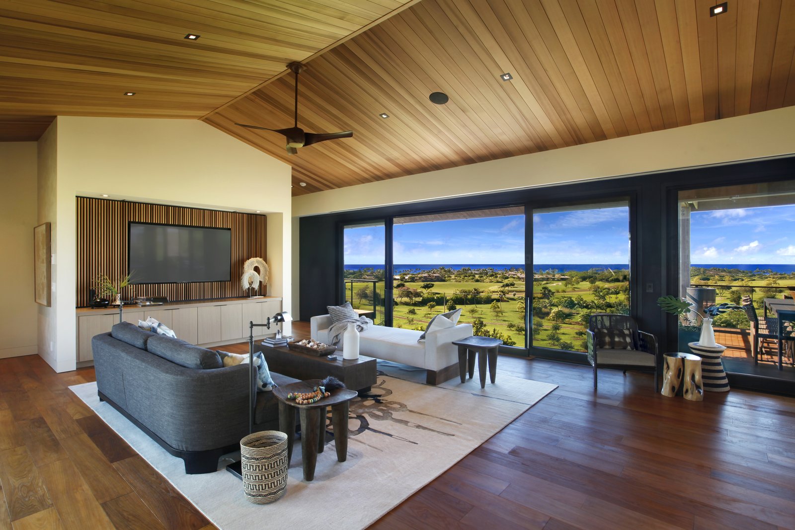 High ceilings with ceiling fans make for breezy interior.