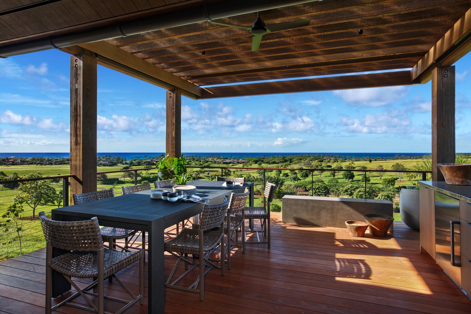 A covered exterior dining area around the pool.