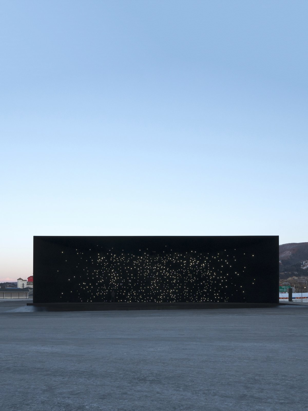 From a distance, the structure has the appearance of a window looking into the depths of outer space.