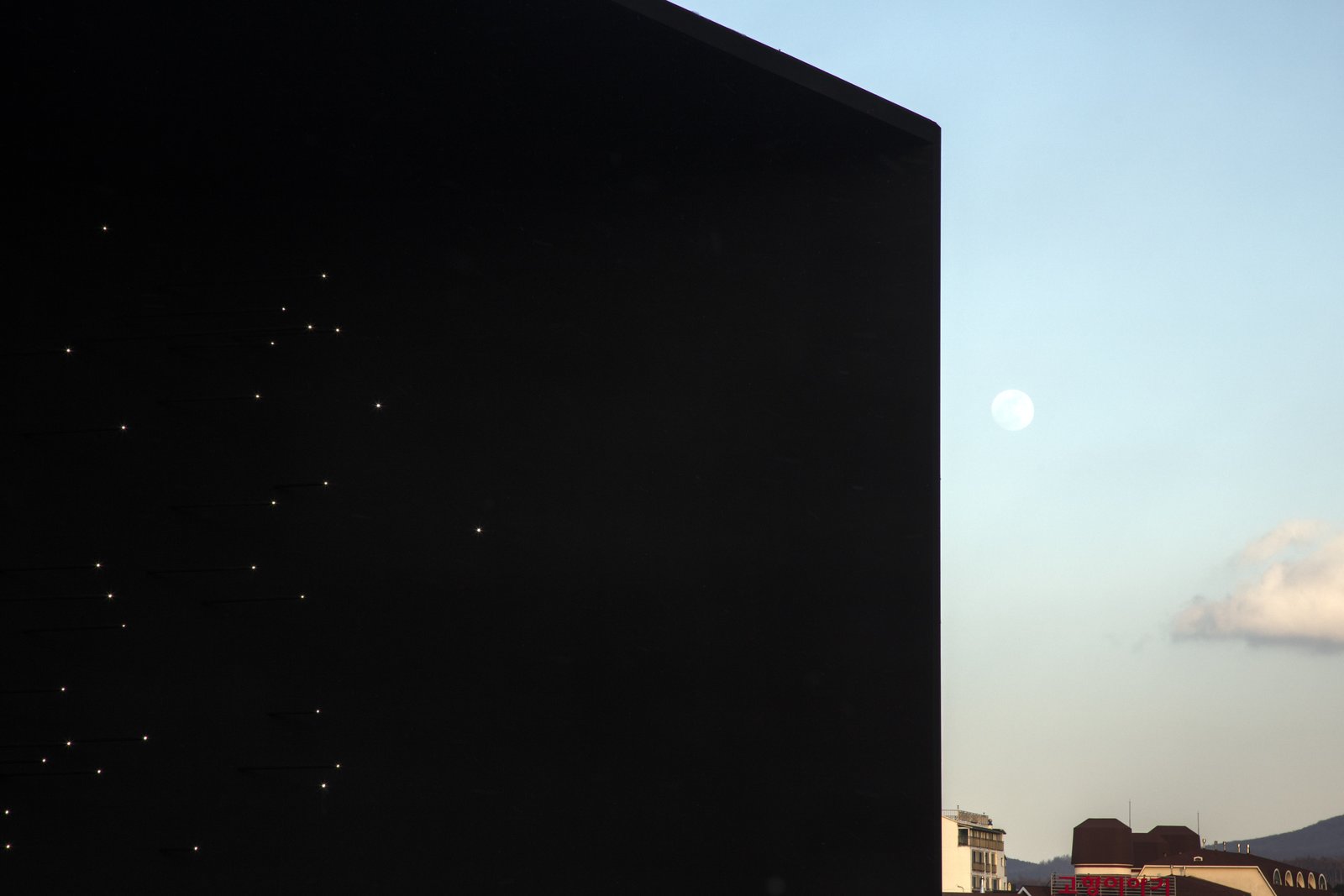 The black façade represents the Universe – the origin of Hydrogen.