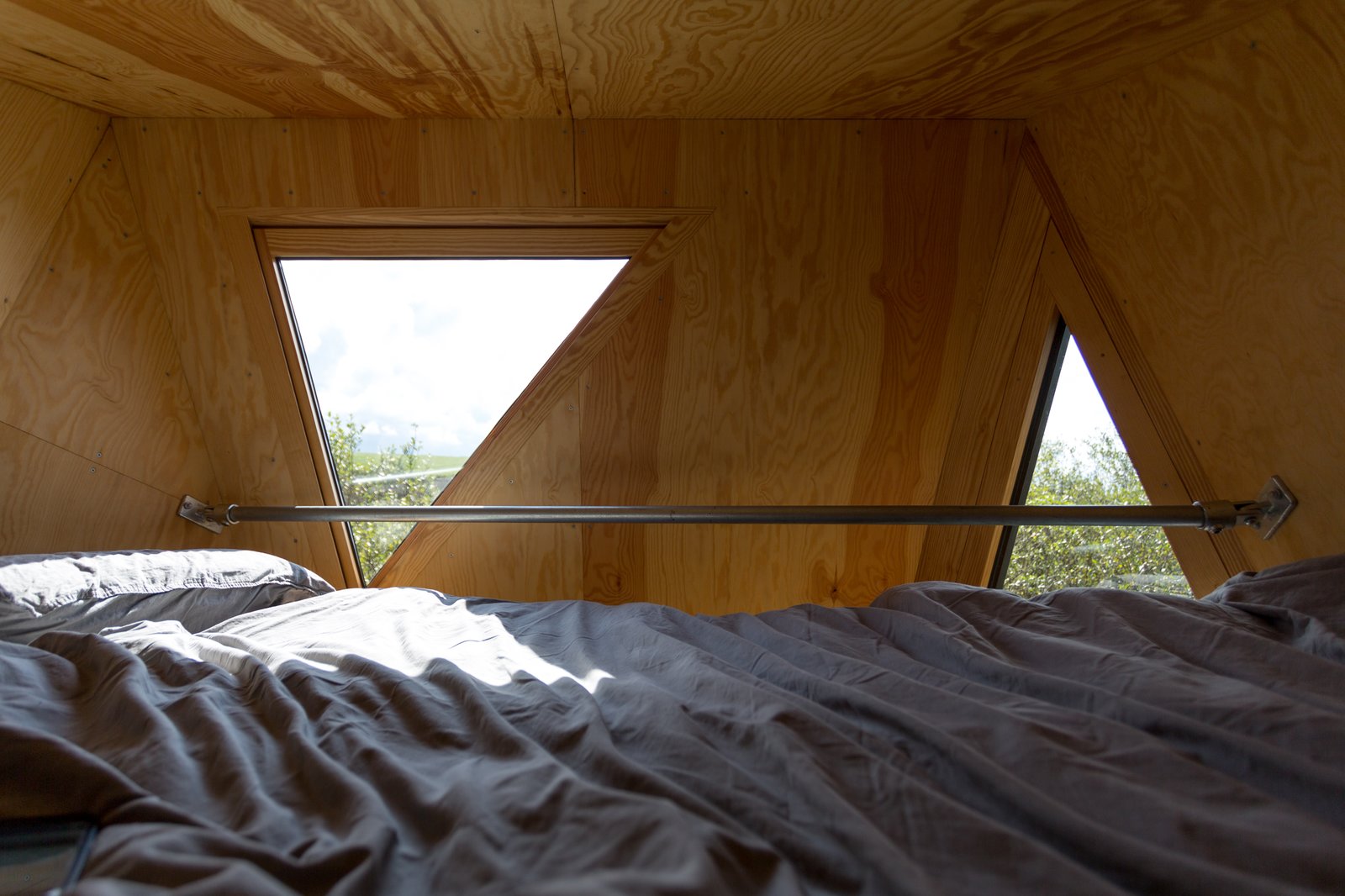 Small triangular windows allow for views of the Cornish countryside.
