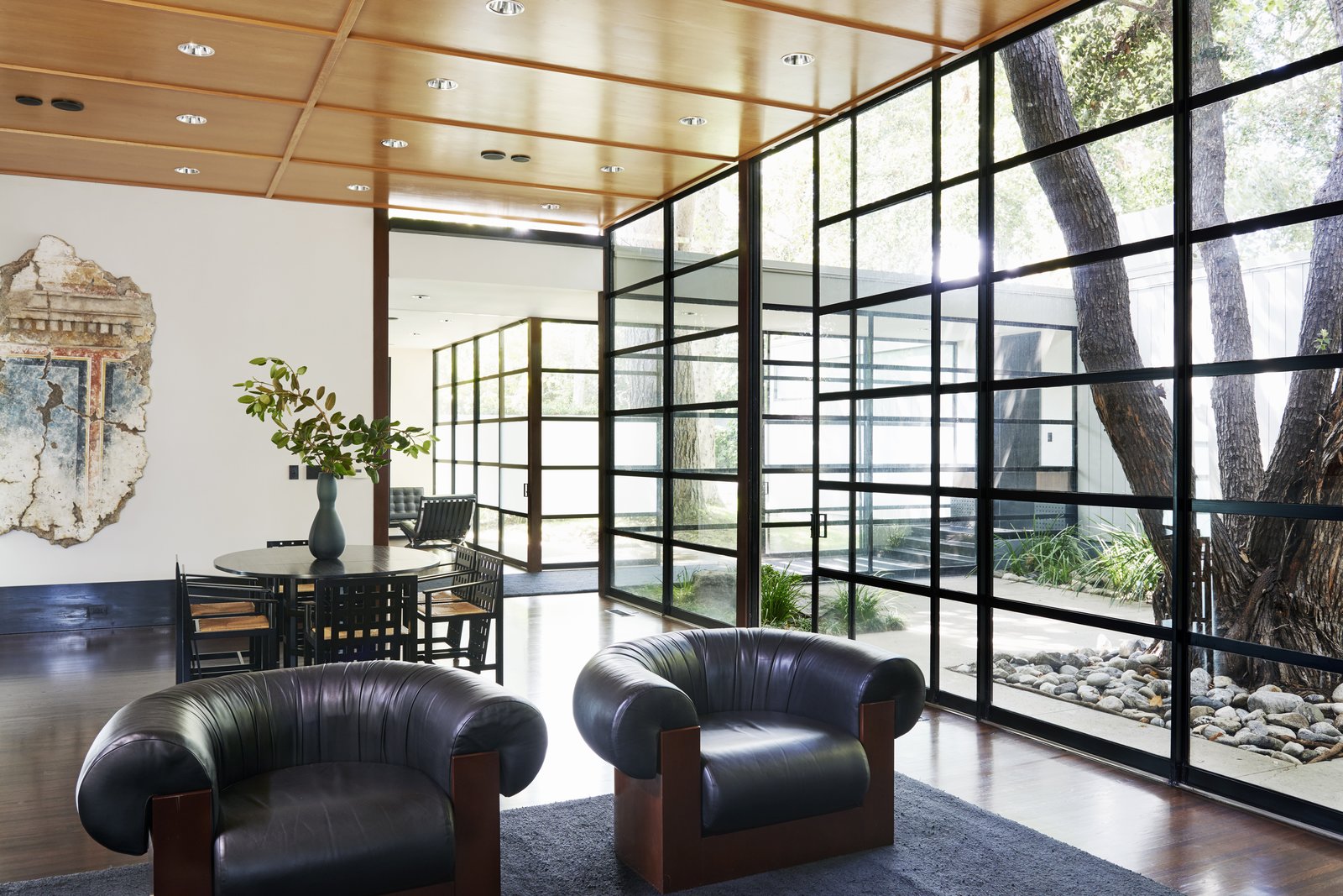 The high-ceilinged living area overlooks the courtyard.