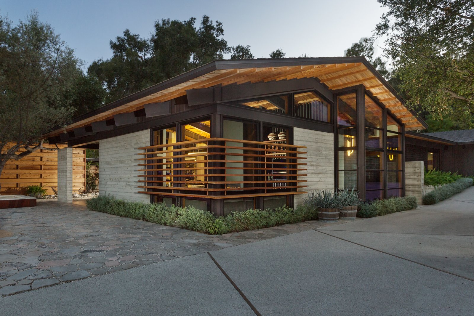 The main house channels a midcentury vibe.