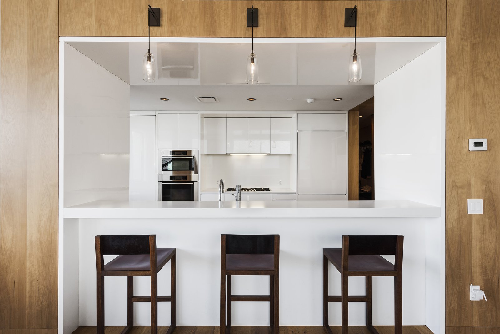 A breakfast bar opens the kitchen to the living room.