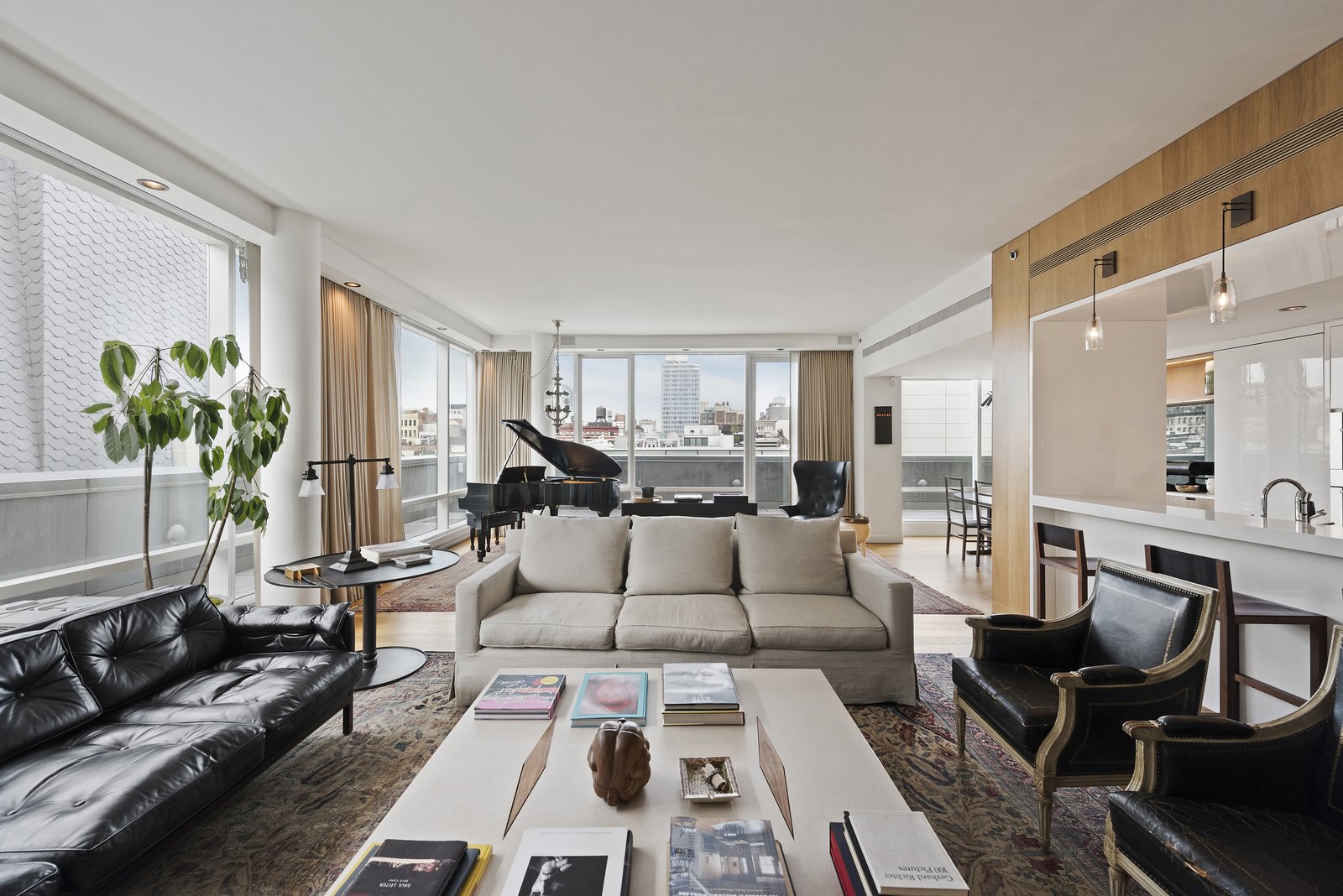 The floor-to-ceiling windows give dramatic proportions and a sweeping view of the city.
