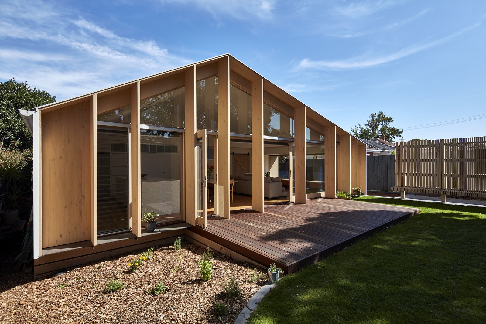 The pitched roof reduces the extension's surface area to 12 percent less than that of a flat-roofed extension, creating a more compact building envelope—which translates to less material needed for construction and less space to heat or cool.