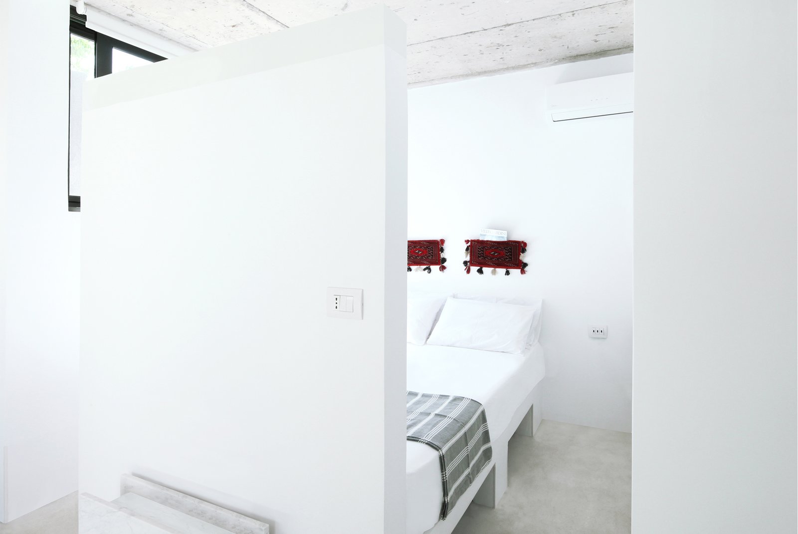 The kitchen opens to the bedroom.