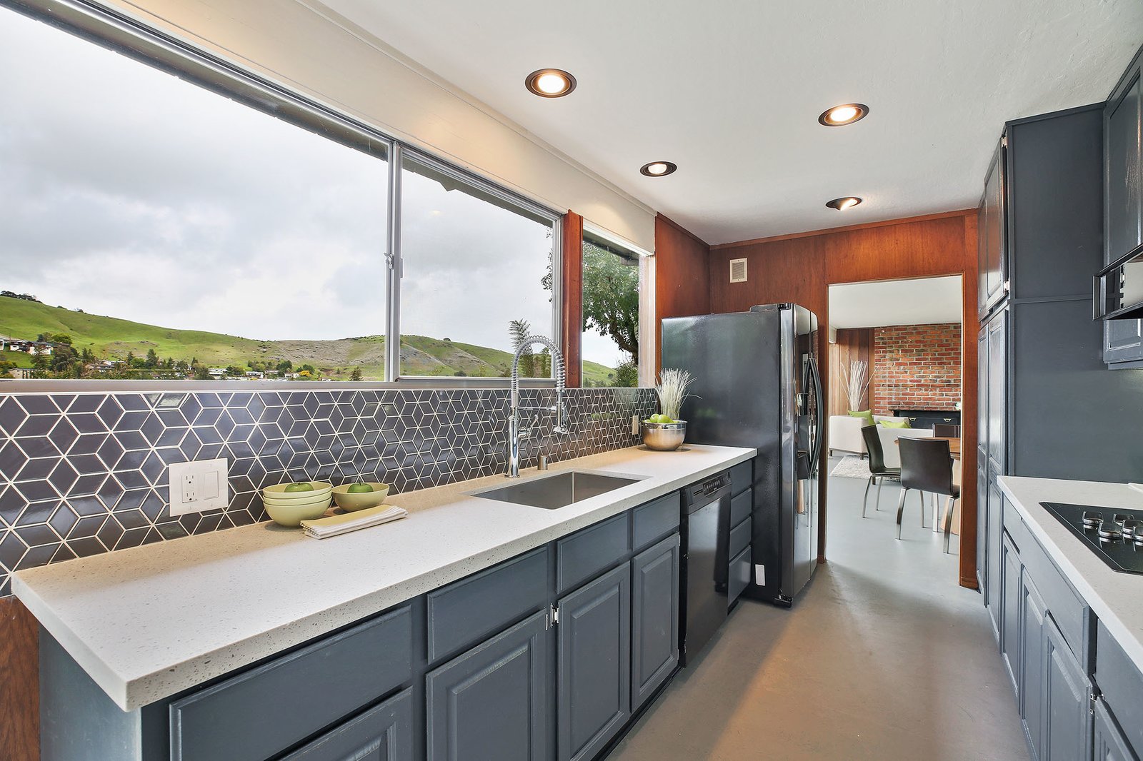 The kitchen connects the living/dining room area and the family room.