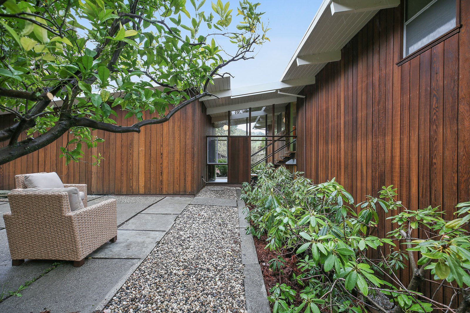 The home has a strong connection to the outdoors, despite missing the central a