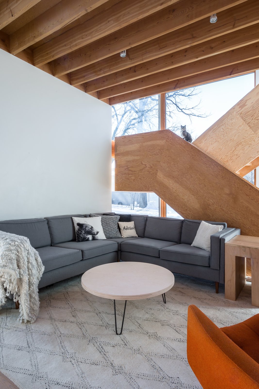 The staircase is constructed of laminated 3/4" plywood sheets, and all of the components are interlocking using mortise and tenon joints instead of fasteners.