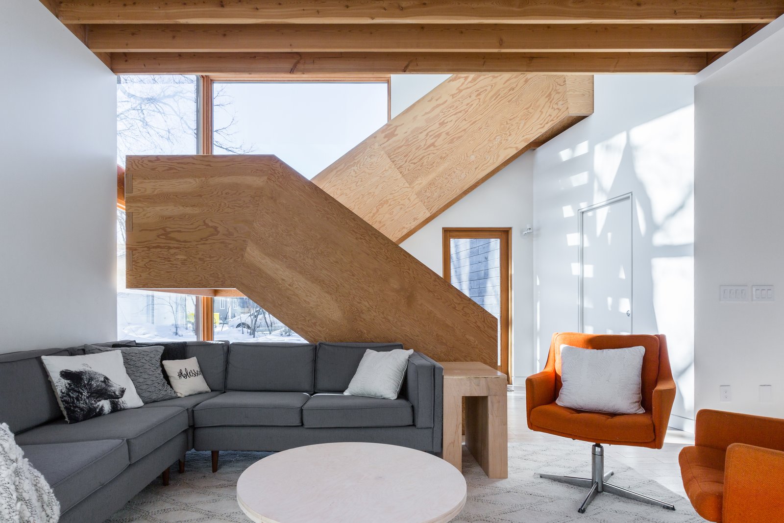 The stylish staircase provides a strong focus for the open-plan interior, and was constructed out of fir plywood by Duerksen himself.