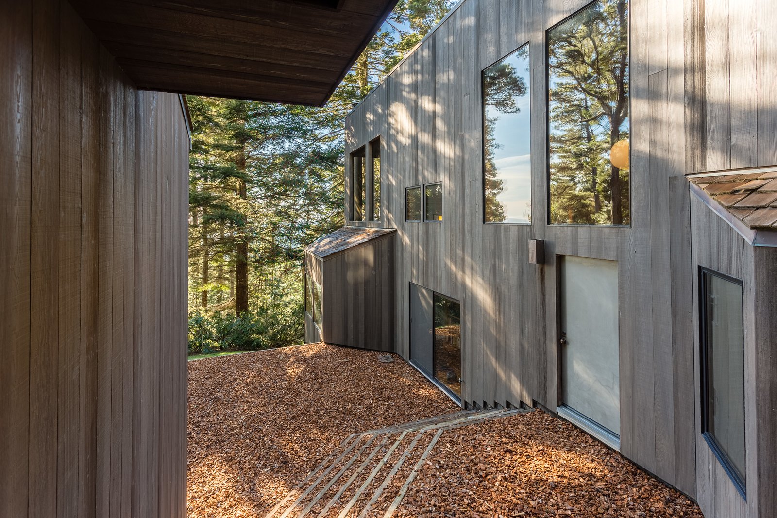 A center walkway separates the two structure.