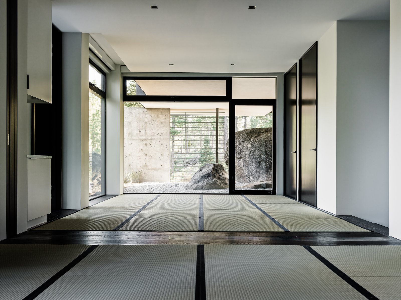A sense of Japanese minimalist design permeates the home and tatami mats were used in a space that leads out to a very zen-like rock garden.