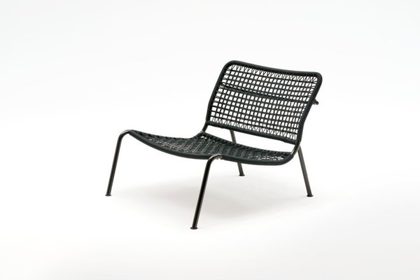 The 'Carbon Frog' armchair by Living Divani. With a carbon fibre frame and a nylon woven seat, it's remarkably light.