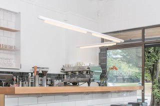 Studio Visit: The Work of ANDlight - Photo 7 of 10 - Pipeline — Design, Caine Heintzman<br><br> The Pipeline’s modular design allows endless shaping possibilities. It has a dimmable, linear LED bulb housed in either a black, white, polished aluminum, or copper finish.