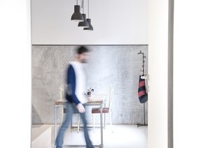 While the aesthetic was meant tho convey a blank slate, historical touches abound inside. Pipes were restored from Gian Nicola Ricci's father's plumbing company, industrial lights from an old second-hand store found new life, and outside of a few IKEA pieces the furniture was all custom-built, mostly from salvaged material.