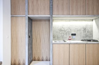 Despite the cast-on-site concrete dividers, there's still an airy sense of space; the dividers support, instead of overwhelm. This approach came from the architects' constant sense of experimentation and playfulness, a deliberate approach that helped them find new ways to use recycled and salvaged materials,