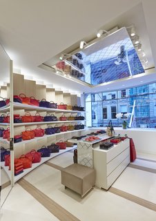 Mural Artist Sets the Scene at Longchamp’s Flagship Store in London - Photo 4 of 4 - Lacing reminiscent of Longchamp’s LM motif appears across ceiling tiles, wall panels, and product display stands, tying the space together. 