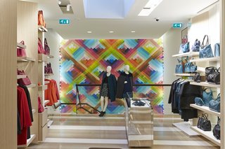 Mural Artist Sets the Scene at Longchamp’s Flagship Store in London - Photo 1 of 4 - The prismatic hues of Maya Hayuk’s mural complement the hot and cool tones of the merchandise lining the walls. 