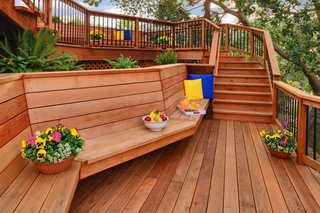 Beauty and Brains: Building Sustainably With Redwood - Photo 2 of 6 - As a structurally sound material, redwood is ideal for both indoor and outdoor projects. Less prone to shrinkage or swelling than other woods, redwood lumber lasts 25 to 35 years with minimal maintenance, and over 100 years when used inside. Redwood is resistant to insects, fire, and rot, adding durability to structures that need to brave the elements. In the summer months, it stays cool enough for bare feet.