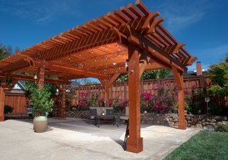 Beauty and Brains: Building Sustainably With Redwood - Photo 6 of 6 - A versatile material, redwood can be left to turn a rustic, silver-tone gray, or finished to take on a glowing tint. A pergola such as this one, which will accompany Humboldt Redwood Company at Dwell on Design, can imbue your backyard space with both stateliness and charm.