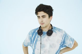 Indie Breakout Act Wet Is In-Residence at Master & Dynamic - Photo 2 of 4 - Sulkow wears the MH40 Over Ear Headphones in black and gray.