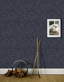 This Wallpaper Collection Gets a Minnesotan Spin - Photo 3 of 3 - Snow in Ebony features silver-toned flakes drifting against a dark background.