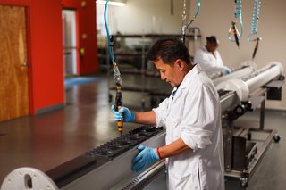 A Meyer Sound employee assembles a CAL column array loudspeaker. By keeping design and manufacturing on the premises of its Berkeley headquarters, the company ensures a high level of quality and customer support.