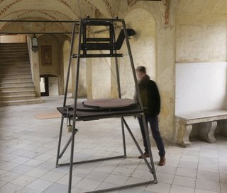 This Kinetic Installation Is a Meditation on Time - Photo 4 of 4 - A motor runs a weighted grinder over the tabletop, creating a moving meditation of continuous time and process.