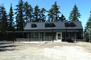 "Our favorite restaurant in Seattle has a huge steel pivot door," says the wife. "We really liked it, so we found it online." The couple toured the Neoporte Modern Door factory and made their selection, a glass sheet encased in stainless steel.