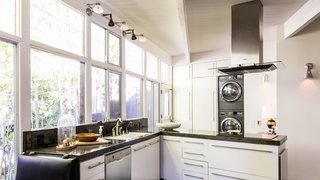 Own a Piece of Hollywood History for $1.995M - Photo 3 of 9 - Modern appliances find a home in an airy kitchen.